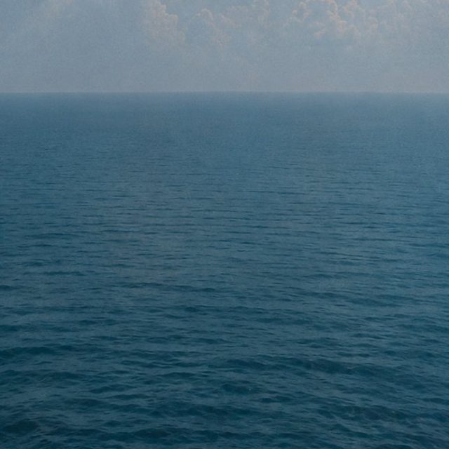 Open water under a pale sky
