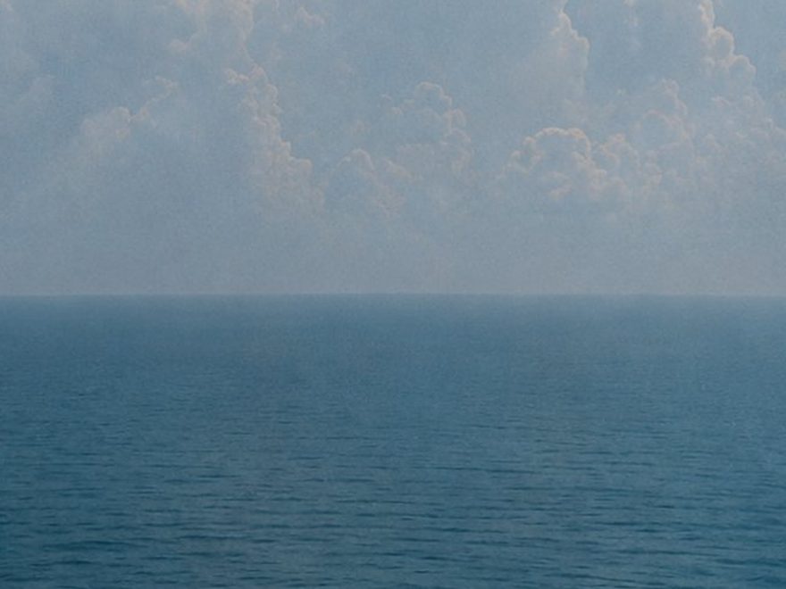 Calm sea meeting a hazy horizon